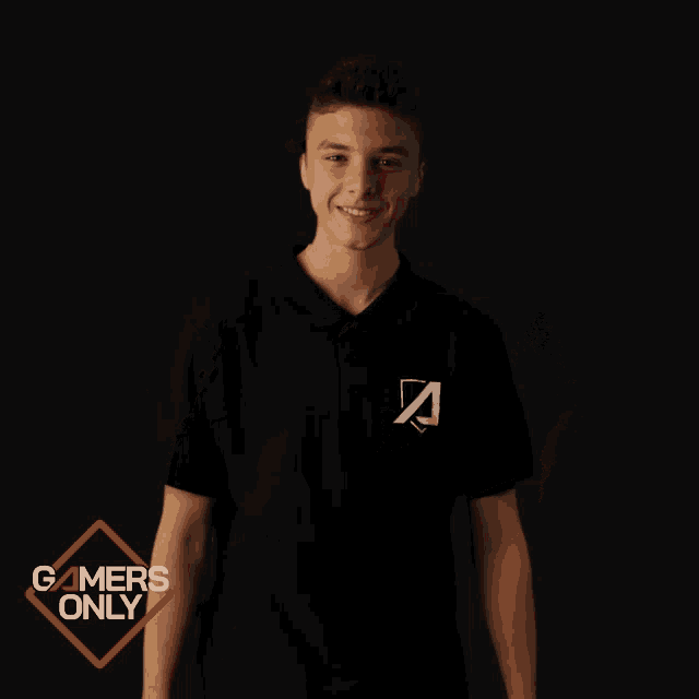 a young man holding a video game controller with a gamers only logo behind him