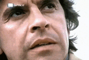 a close up of a man 's face with the word space on the bottom right