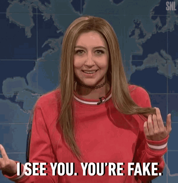 a woman in a red sweater is saying i see you you 're fake