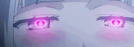 a close up of a person 's eyes with hearts in them