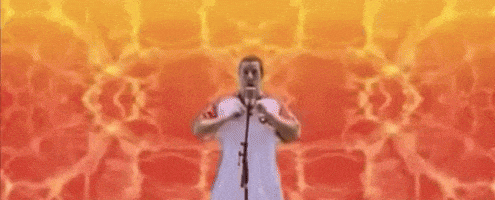 a man is standing in front of a microphone with his arms in the air and the words fu kin behind him .