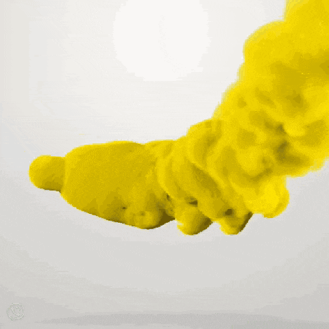 blue and yellow smoke is coming out of a bottle