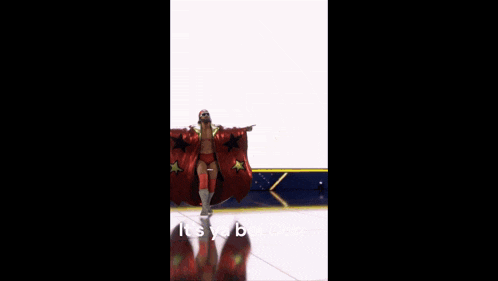 a man wearing a shirt that says mach man is dancing