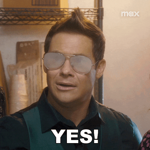 a man wearing sunglasses says " yes " in white letters