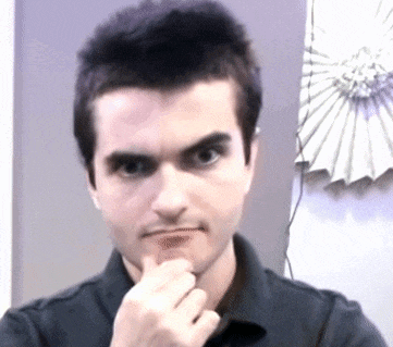 a man in a black shirt is thinking with his hand on his chin