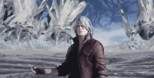 a man in a brown leather jacket is standing in a desert .