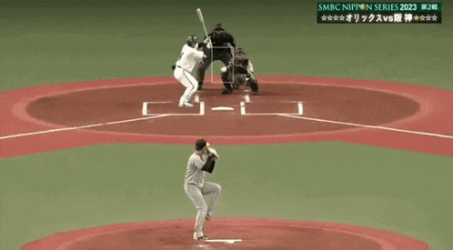 a baseball player with the number 18 on the back of his jersey swings at a pitch