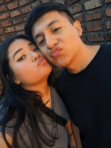 a man and a woman are making funny faces