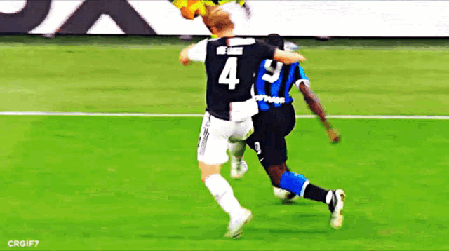a soccer player wearing a number 4 jersey is being tackled by another player wearing a number 9 jersey