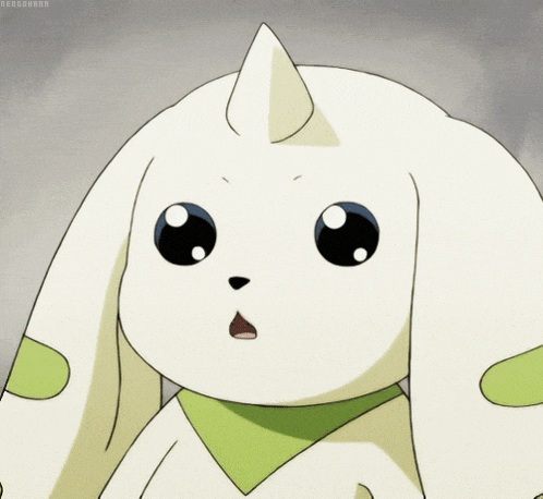 a white rabbit with a green scarf around its neck has a surprised look on its face