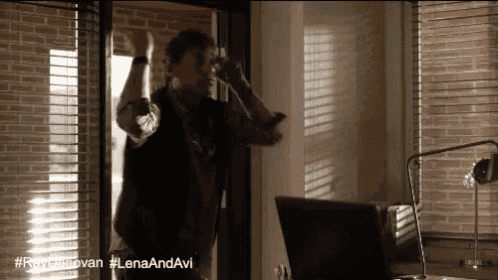 a man is standing in front of a window with the hashtag lanaandavi