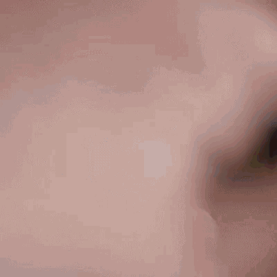 a man with a beard is making a funny face with his arms outstretched in a blurry photo .