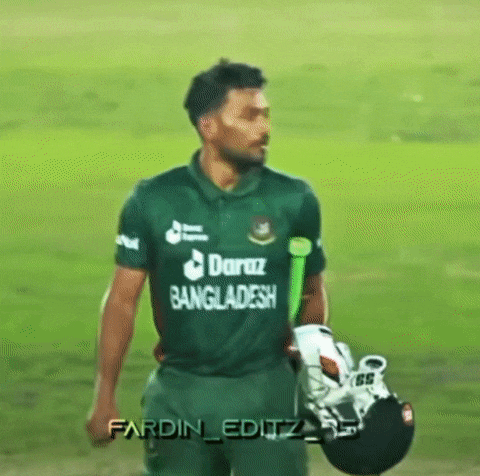 a cricket player from bangladesh is walking on a field holding his helmet and bat .