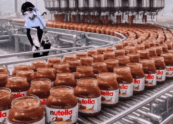 jars of nutella are lined up on a conveyor belt