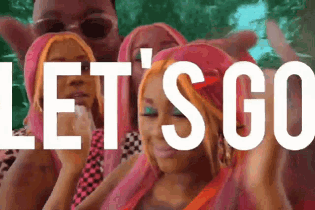 a group of people with pink hair and the words let 's go in white letters