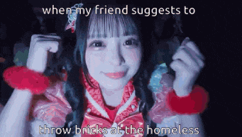 a girl in a pink dress is smiling while a friend suggests to throw bricks at a homeless person .