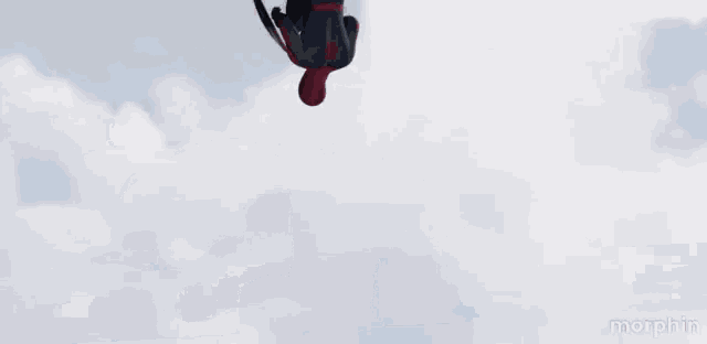 a man in a spiderman costume is holding a shield with a star on it