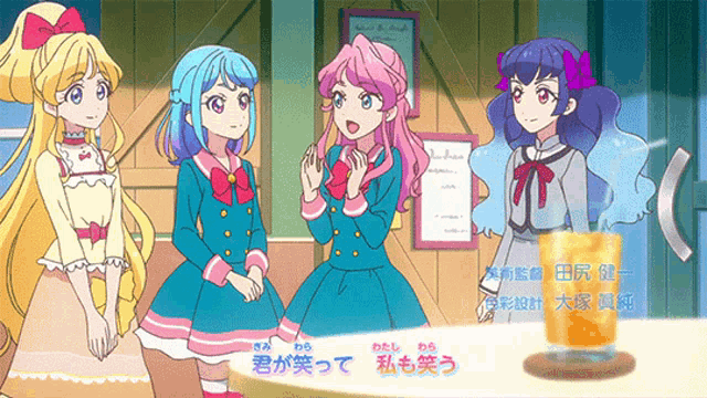 a group of anime girls are standing next to each other with a glass of orange juice in front of them