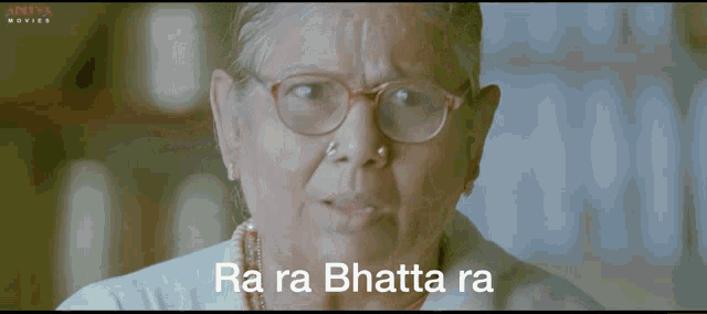an older woman with glasses and a nose ring says " ra ra bhatta ra "