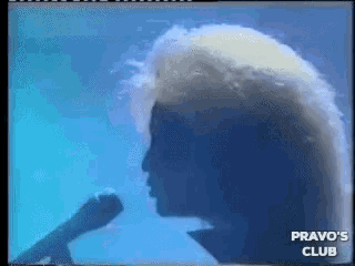 a silhouette of a man singing into a microphone with the words pravo 's club below it