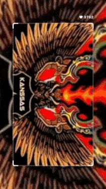 a phone screen shows a colorful drawing of a mask with the word kansas on it