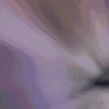 a woman in fishnet stockings is singing into a microphone