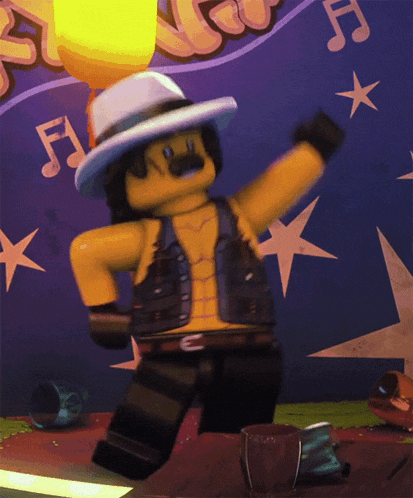 a lego man is dancing in front of a wall with music notes