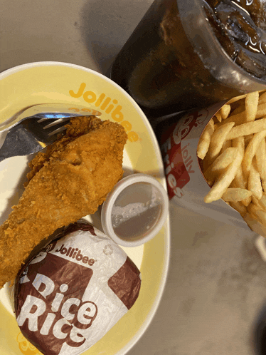 a jollibee fried chicken meal with rice rice and french fries