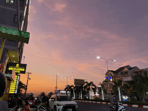 a busy street with a sign that says sim long hotel