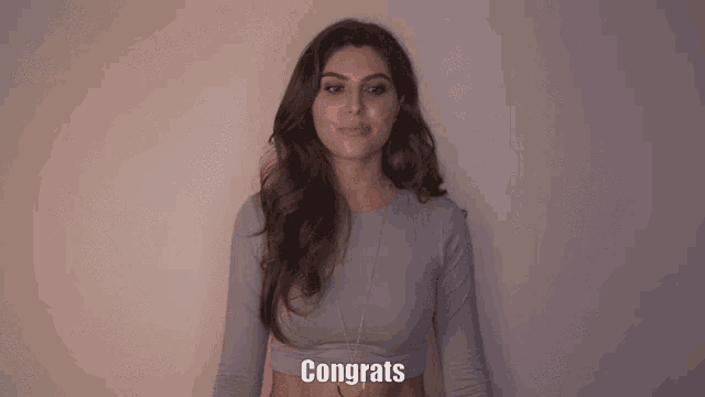a woman with a surprised look on her face is congratulating someone