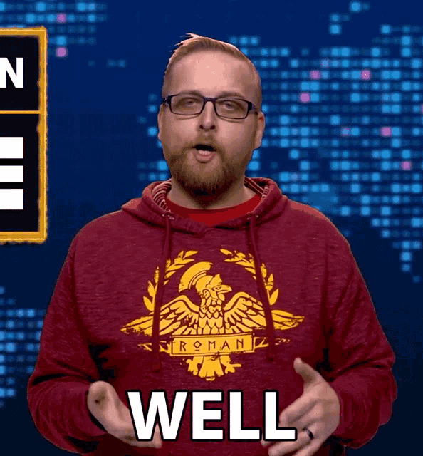 a man wearing a red hoodie with roman on it