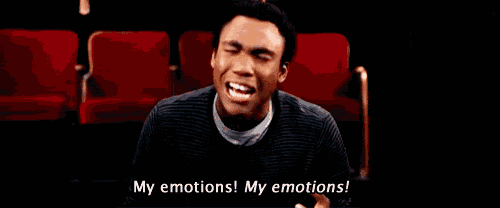 a man is sitting in a theater with his eyes closed and says my emotions my emotions !