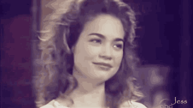 a black and white photo of a woman with the name jess on the bottom left