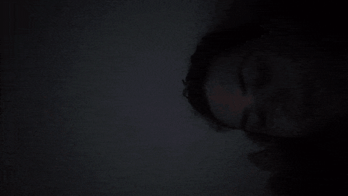 a person 's head is glowing in a red light