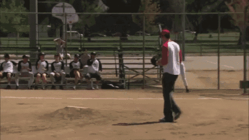 a man in a red and white baseball uniform throws a pitch