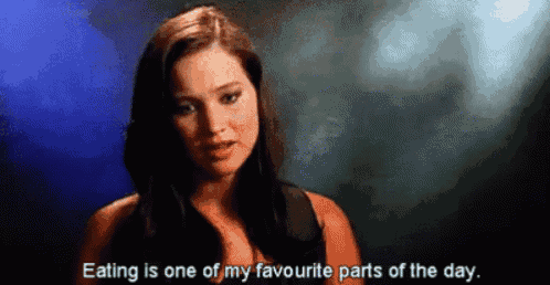 a woman is talking about eating and says eating is one of my favourite parts of the day .