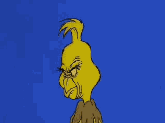 the grinch is a cartoon character with a very angry face .