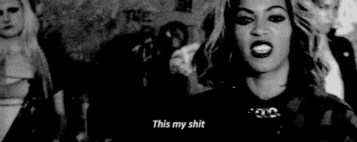 a black and white photo of a woman making a funny face and saying this my shit .