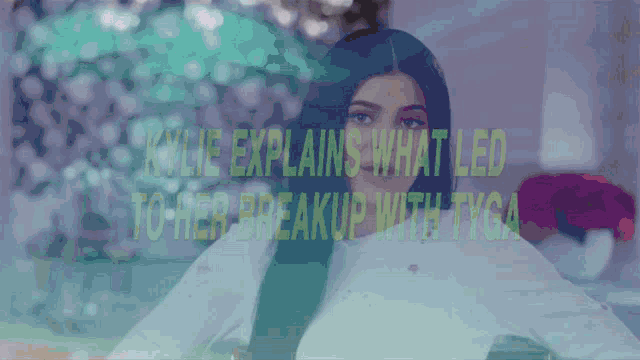 a woman with long black hair is wearing a white sweater and making a funny face