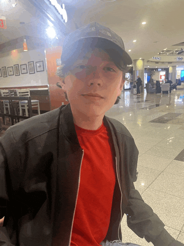 a boy wearing a hat that says north face