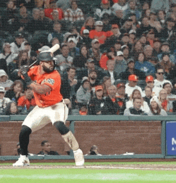 a baseball player with the number 21 on his jersey swings at a ball