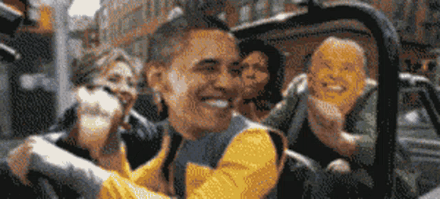 a man in a yellow jacket is driving a car with two women behind him