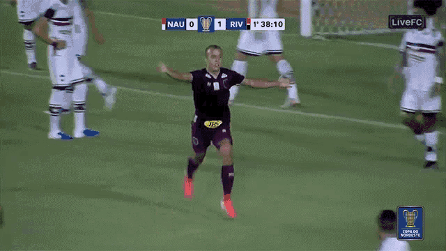 a soccer player celebrates a goal during a live fc game