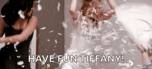 two women are having a pillow fight with feathers falling around them and the caption says have fun tiffany !