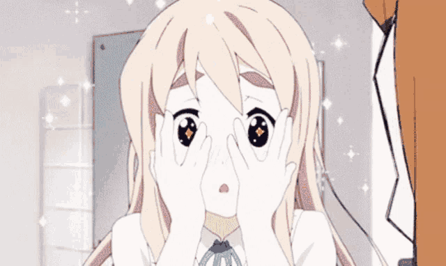 a girl covering her eyes with her hands and a surprised look on her face
