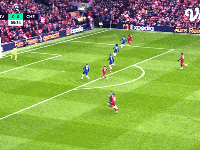 a soccer game is underway with expedia advertising on the sidelines