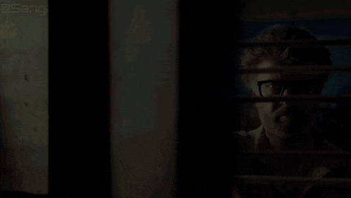 a man with glasses looks through a window with the hashtag sanga0232