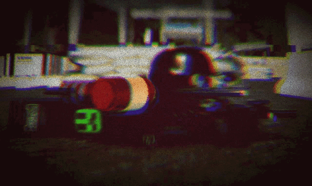 a blurred image of a race car with the number 33 on the side