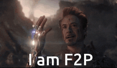 a man is holding something in his hand with the words i am f2p written on it .