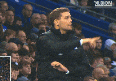 a man with the word albion on his jacket
